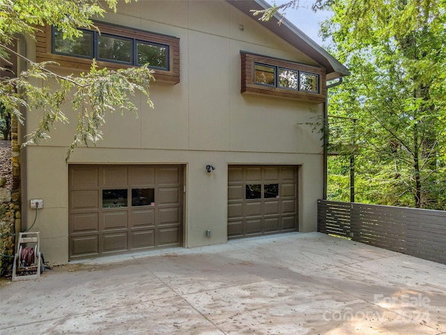 view of side of property with a garage