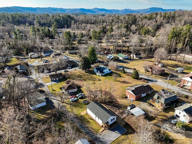 birds eye view of property with a mountain view