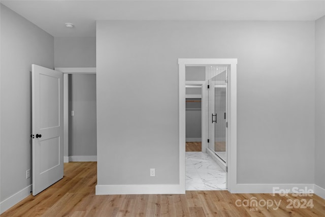 unfurnished bedroom featuring light wood-type flooring