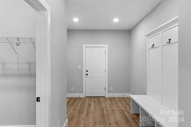 mudroom with light hardwood / wood-style floors