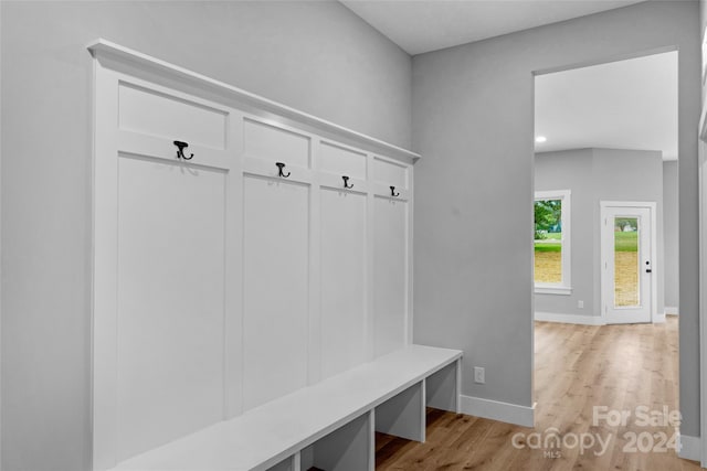 mudroom with light hardwood / wood-style flooring