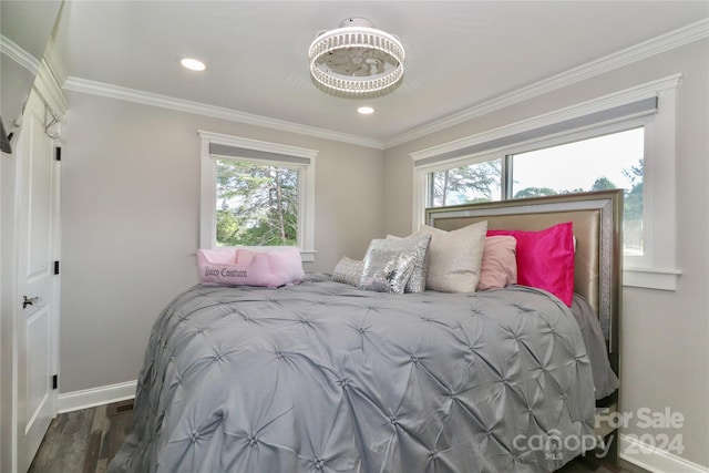 bedroom featuring ornamental molding and hardwood / wood-style floors