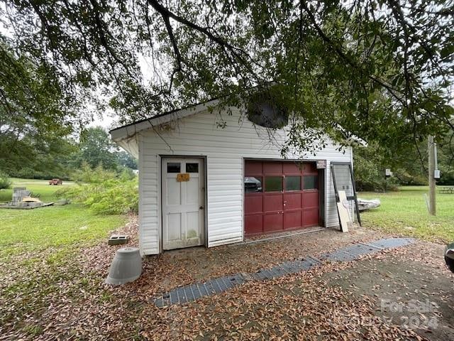 garage with a yard