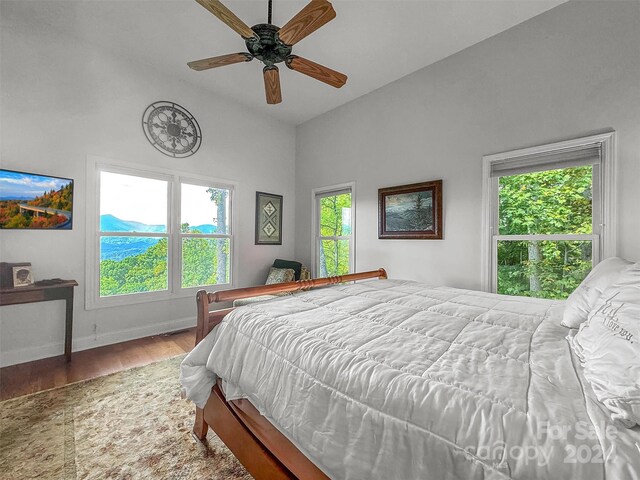 445 Equestrian Dr, Waynesville, NC 28786 - bedroom featuring wood finished floors, baseboards, ceiling fan, and lofted ceiling