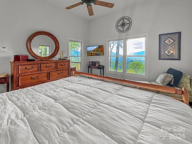 bedroom featuring multiple windows and ceiling fan