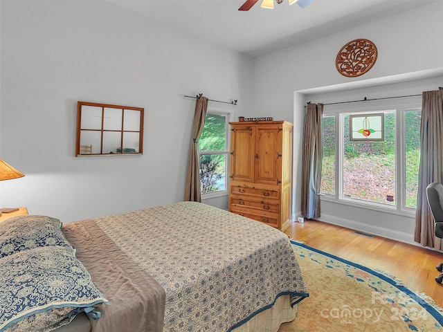 bedroom featuring hardwood / wood-style flooring and ceiling fan