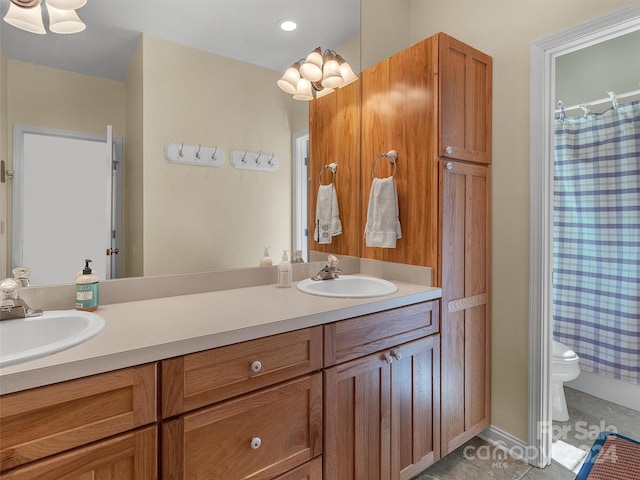 bathroom with tile patterned floors, vanity, toilet, and a shower with curtain