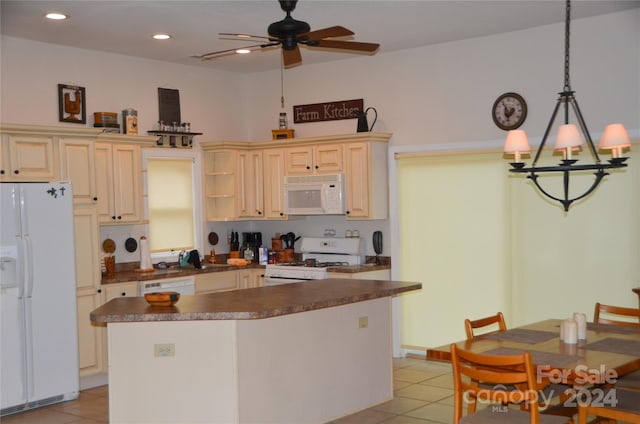 kitchen with cream cabinets, pendant lighting, white appliances, and light tile patterned floors