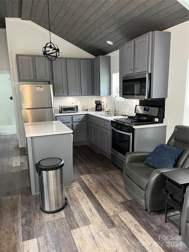 kitchen featuring appliances with stainless steel finishes, wood ceiling, gray cabinets, lofted ceiling, and decorative light fixtures