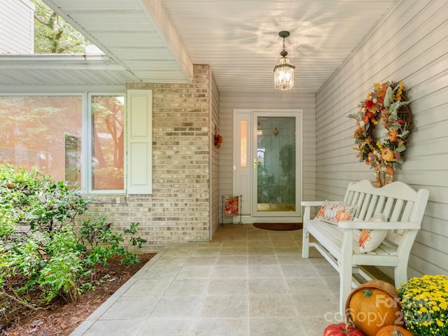 doorway to property featuring a patio area