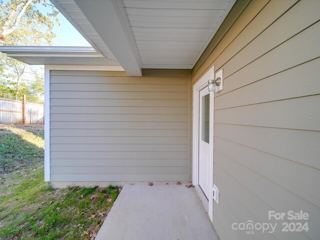 doorway to property with fence