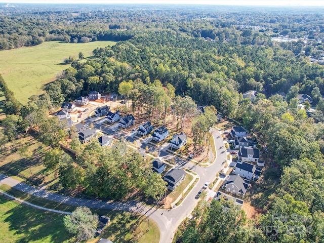 drone / aerial view with a view of trees