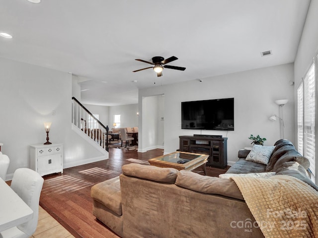 living room with ceiling fan and hardwood / wood-style floors