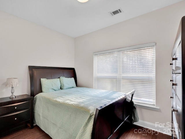 bedroom featuring dark hardwood / wood-style floors