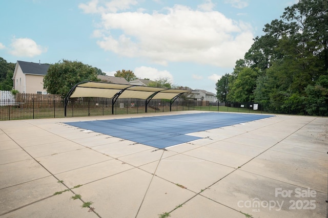 view of swimming pool with a patio area