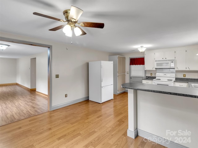 kitchen with ceiling fan, white cabinets, light hardwood / wood-style floors, and white appliances