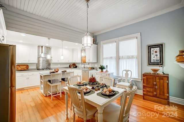 dining area with wood ceiling, sink, and light wood-type flooring