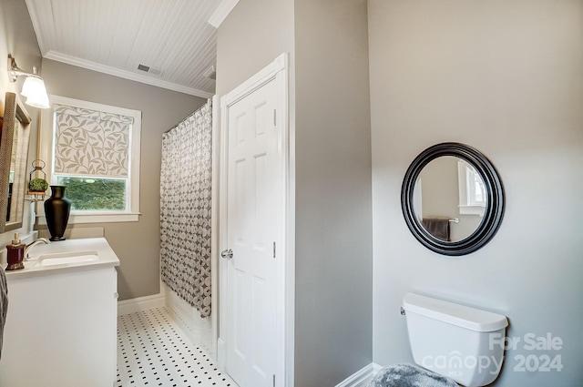 bathroom with vanity, toilet, ornamental molding, and curtained shower