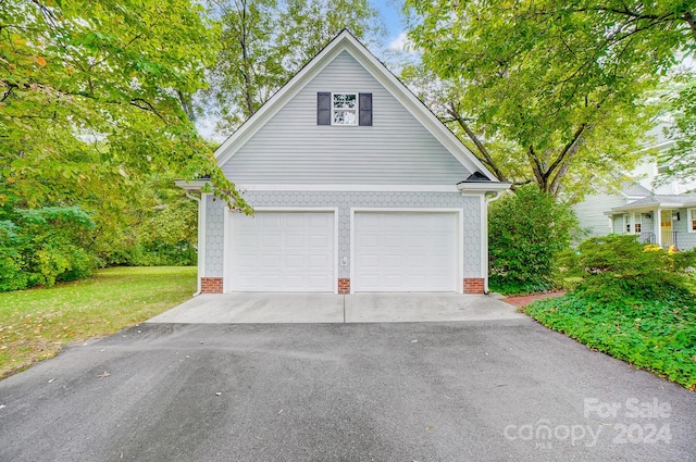 garage with a lawn