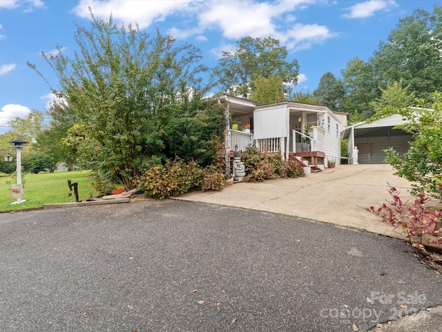 view of front of home with a front yard and covered porch