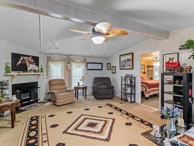 carpeted living room featuring ceiling fan and lofted ceiling with beams