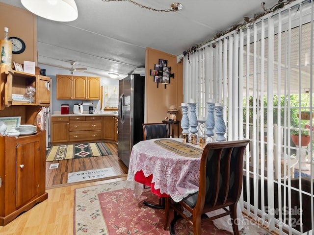 dining space with light wood-type flooring