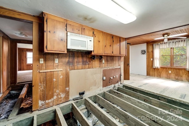 kitchen featuring wooden walls