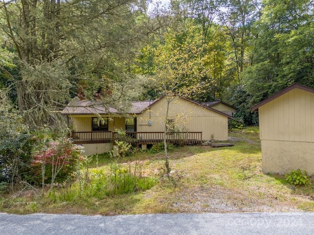 view of front of home with a wooden deck