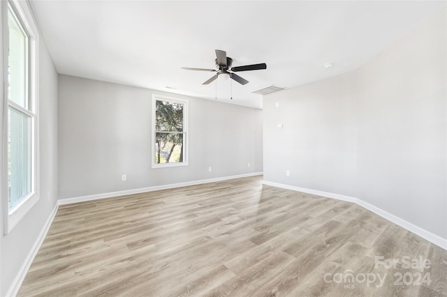 unfurnished room featuring ceiling fan and light hardwood / wood-style flooring