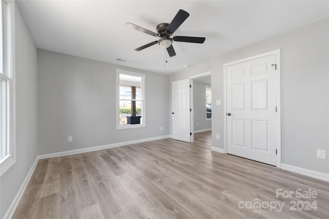 unfurnished room featuring ceiling fan and light hardwood / wood-style floors