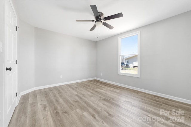 spare room with ceiling fan and light hardwood / wood-style flooring