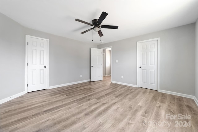 unfurnished bedroom with light hardwood / wood-style flooring and ceiling fan