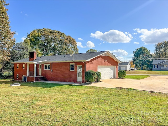 ranch-style home featuring cooling unit, a front yard, and a garage