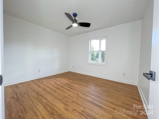 empty room featuring ceiling fan and wood-type flooring