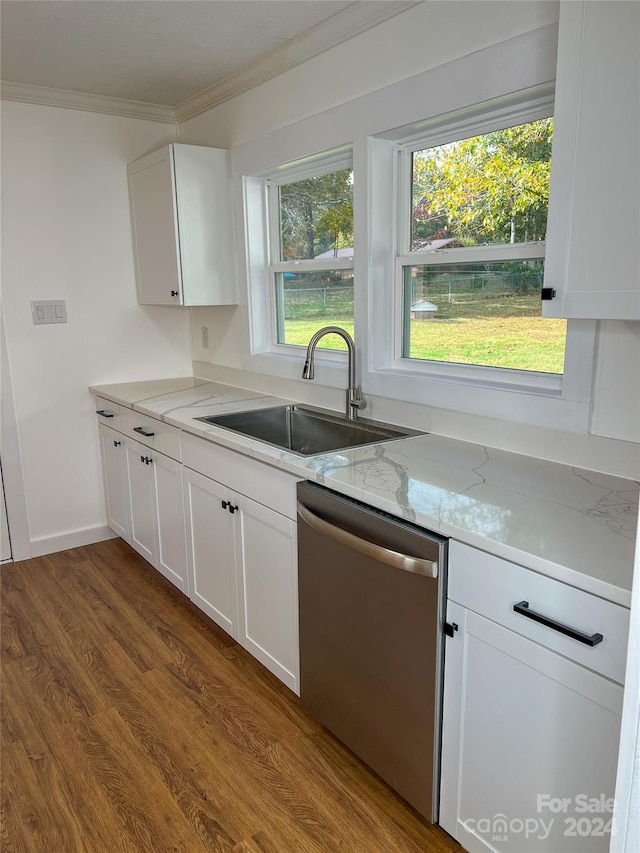 kitchen with hardwood / wood-style floors, sink, stainless steel dishwasher, light stone counters, and white cabinetry