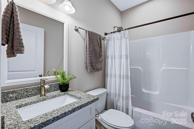 full bath featuring vanity, toilet, and shower / tub combo with curtain