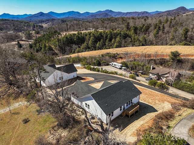 aerial view with a forest view and a mountain view