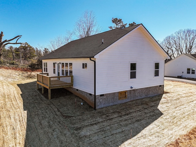 back of property featuring a shingled roof, crawl space, and a wooden deck