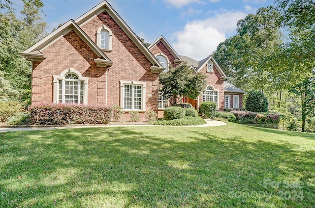 view of property featuring a front yard