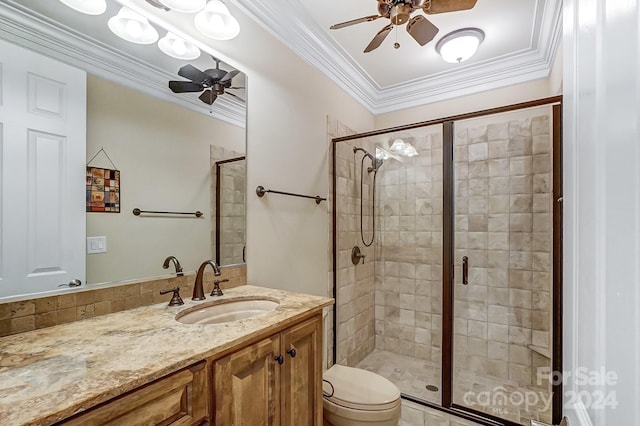 bathroom with ceiling fan, a shower with door, vanity, and toilet