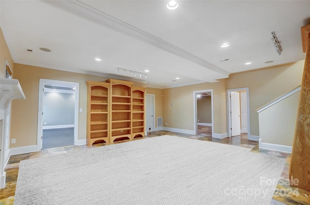 unfurnished living room featuring crown molding and light hardwood / wood-style flooring