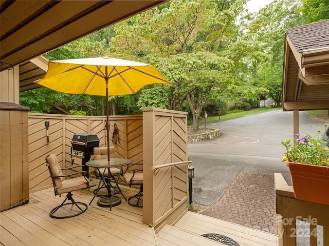 wooden terrace with a patio