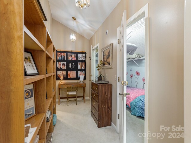 interior space featuring an inviting chandelier and vaulted ceiling