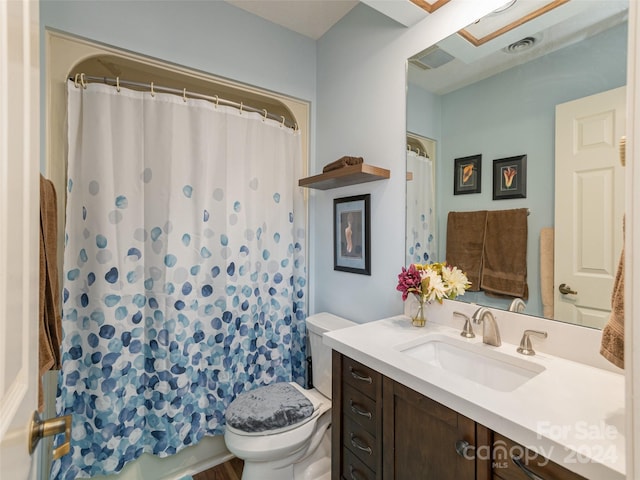 bathroom with vanity, toilet, and a shower with curtain