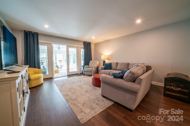 living room with dark hardwood / wood-style floors