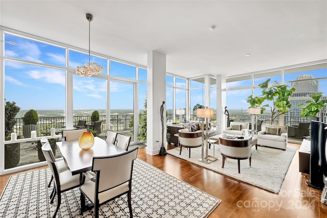 sunroom with a chandelier