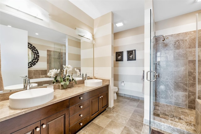 bathroom featuring walk in shower, vanity, and toilet