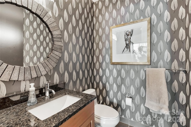 215 N Pine St Unit 3705, Charlotte, NC 28202 - bathroom featuring wallpapered walls, toilet, and vanity