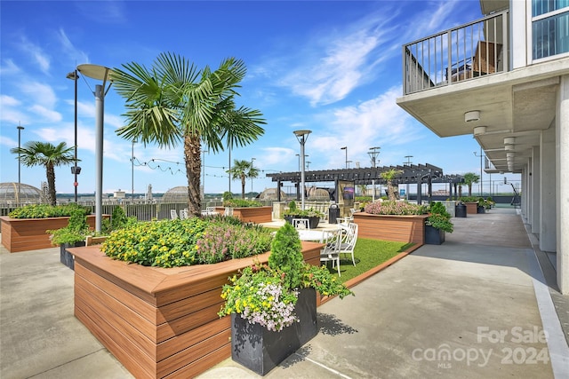 surrounding community with a pergola and a patio area