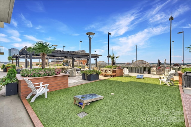 surrounding community with a pergola, a patio, and a yard